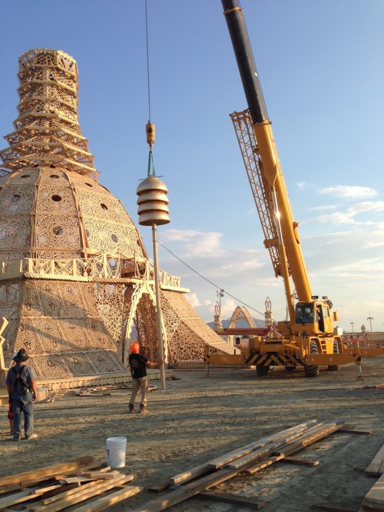 DOMES BEING LIFTED BY CRANE