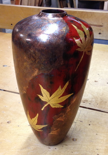 Student brought a vessel to the class and applied metal leaf followed with chemicals to create a patina.