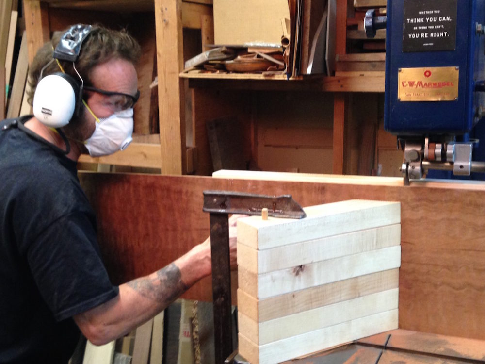 David has stacked feather boards clamped in place to support the board firmly against the fence. Note the small sign on the bandsaw " Whether you THINK YOU CAN or think you can't YOU’RE RIGHT ".